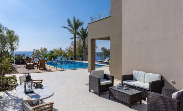 Crete Lasithi area . For sale luxury villa with private rocky  beach and private poo in a plot of 1450 sqm