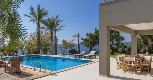 Crete Lasithi area . For sale luxury villa with private rocky  beach and private poo in a plot of 1450 sqm
